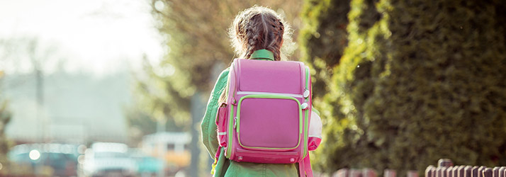 Chiropractic Calgary AB Girl Wearing Backpack Spine Health