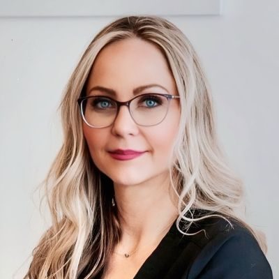 Registered Nurse Calgary AB Sarah Paetschke Meet The Team Sarah Paetschke headshot with glasses